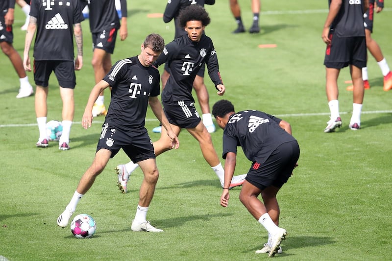 Thomas Mueller controls the ball as Serge Gnabry and Leroy Sane look on. Getty Images
