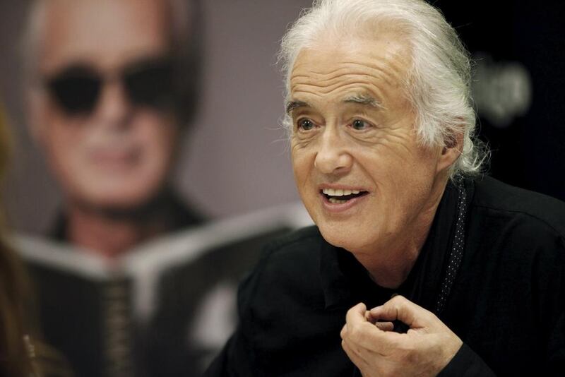 British rock musician and former guitarist for Led Zeppelin, Jimmy Page smiles at fans in Toronto (REUTERS/Hans Deryk)