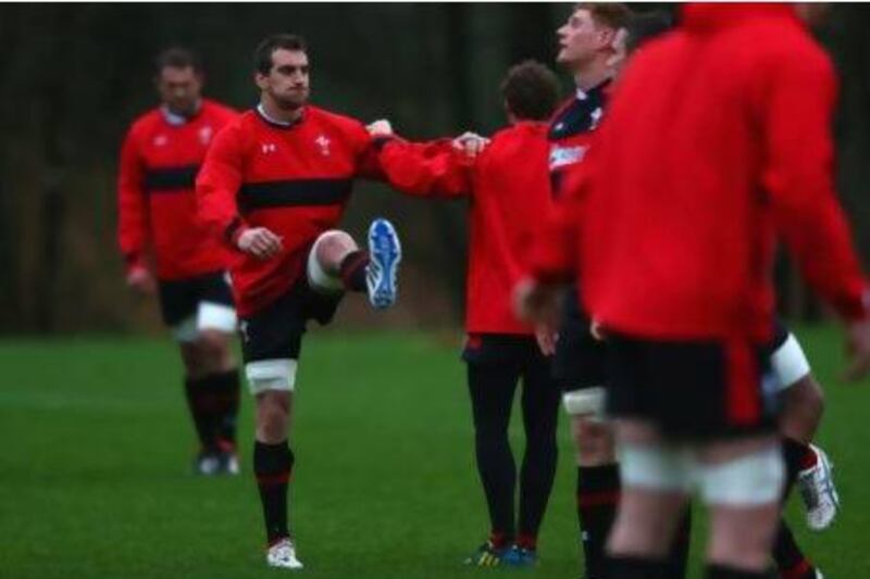 Sam Warburton, left, captain of Wales warms up during a training session on Tuesday. Warburton is one of several breakaway forwards who will captain his side into the Six Nations tournament.