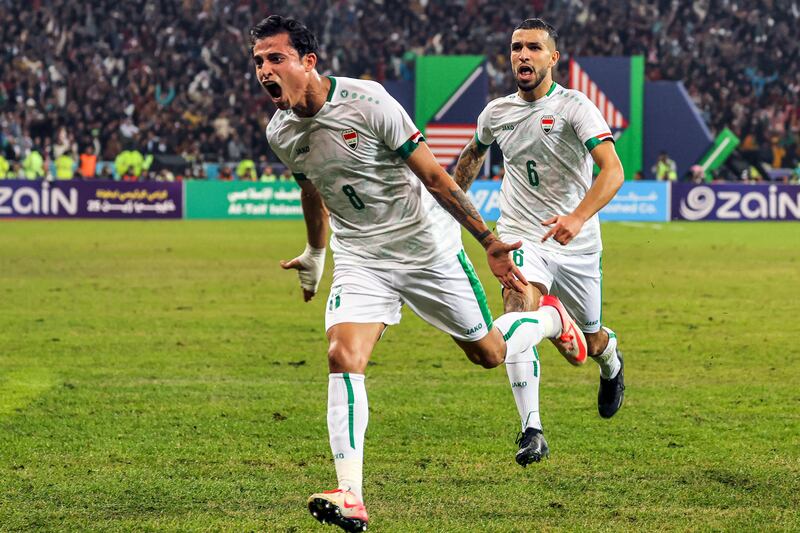 Iraq midfielder Ibrahim Bayesh, left, reacts after scoring his team's first goal against Oman during the 25th Arabian Gulf Cup final at the Basra International Stadium on Thursday. AFP