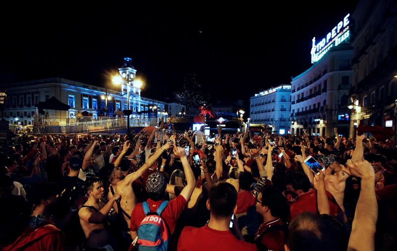 Liverpool fans celebrate their success. EPA