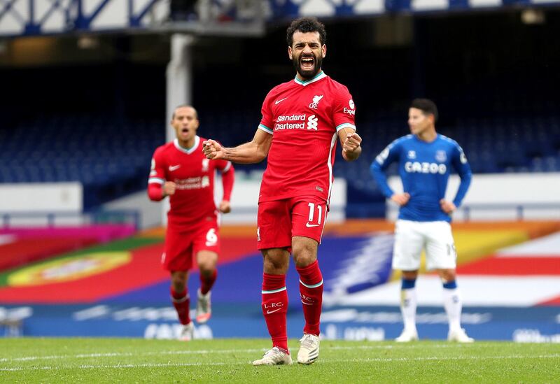 LIVERPOOL, ENGLAND - OCTOBER 17: Mohamed Salah of Liverpool celebrates after scoring his team's second goal during the Premier League match between Everton and Liverpool at Goodison Park on October 17, 2020 in Liverpool, England. Sporting stadiums around the UK remain under strict restrictions due to the Coronavirus Pandemic as Government social distancing laws prohibit fans inside venues resulting in games being played behind closed doors. (Photo by Catherine Ivill/Getty Images)