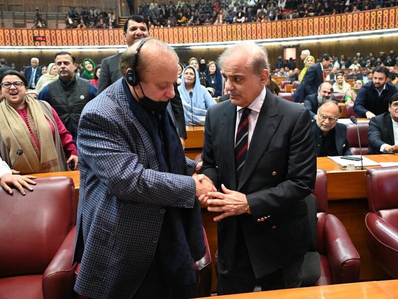 Shehbaz Sharif, right, is congratulated by his brother Nawaz Sharif after being elected Pakistan's Prime Minister in the National Assembly on Sunday. EPA