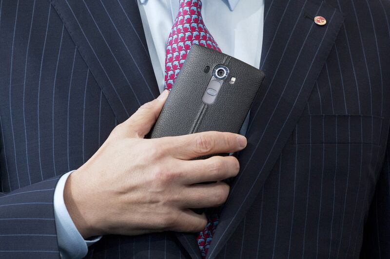 Juno Cho, president and CEO of LG , holds the LG G4. Mark Lennihan / AP Photo
