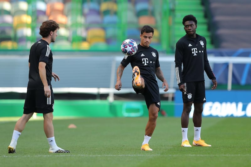 Philippe Coutinho, centre, and Alphonso Davies during training on Tuesday. EPA