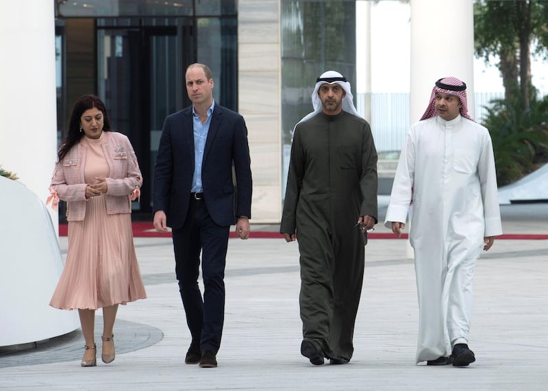 Britain's Prince William (2nd L) walks with Deputy Minister of the Diwan Amiri, Sheikh Mohammed Abdullah Mubarak al Sabah (2nd R) during his visit in Midan Hawalli, Kuwait. REUTERS