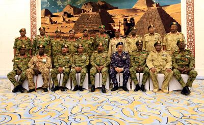 Sudan's President Omar al-Bashir (5R, bottom row) is seen during a swearing in ceremony of new officials after he dissolved the central and state governments in Khartoum, Sudan February 24, 2019. REUTERS/Mohamed Nureldin Abdallah