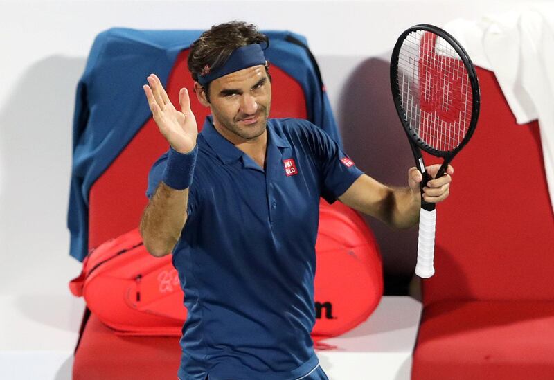Roger Federer applauds the crowd after his 6-4, 3-6, 6-1 first-round victory in Dubai. Reuters