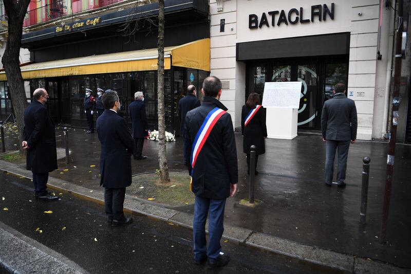 French Prime Minister Jean Castex, Paris Mayor Anne Hidalgo, French Justice Minister Eric Dupond-Moretti, and French Interior Minister Gerald Darmanin pay tribute outside the Bataclan concert venue, in Paris. EPA