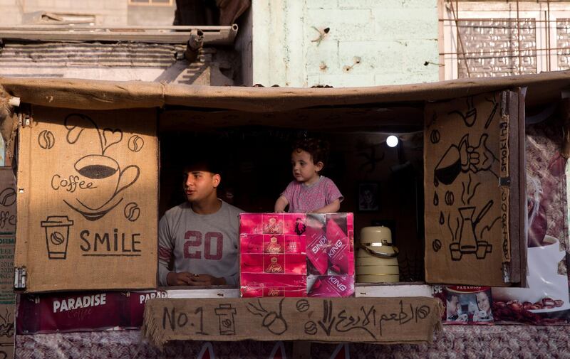 A Palestinian youth sells cigarettes at the beach, in Gaza City.  AP Photo