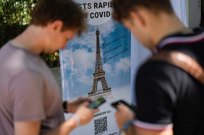 Visitors register for Covid-19 tests at the Eiffel Tower in Paris. AP Photo