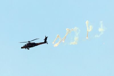 An Israeli army helicopter fire flares above the Gaza Strip on Tuesday. AFP