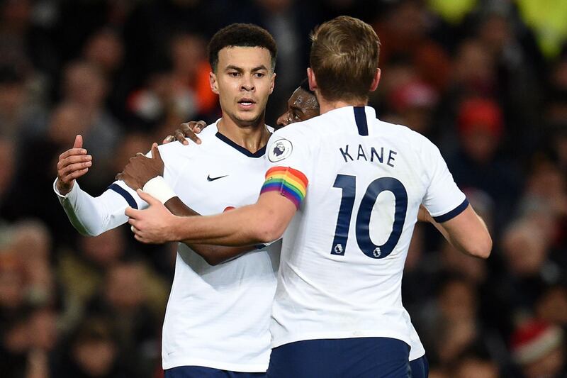 Dele Alli celebrates with Harry Kane after scoring Tottenham's equaliser. AFP