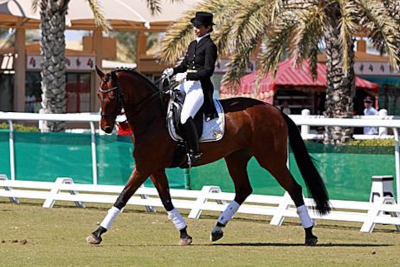 Farah al Khojai riding her horse Donna Bellissimia prior to competing in the Asian Games.