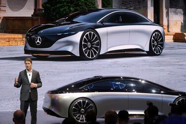 Ola Kaellenius, chairman of the board of management of Daimler, speaks next to a Mercedes-Benz Vision EQS electric vehicle at an event in China. Reuters