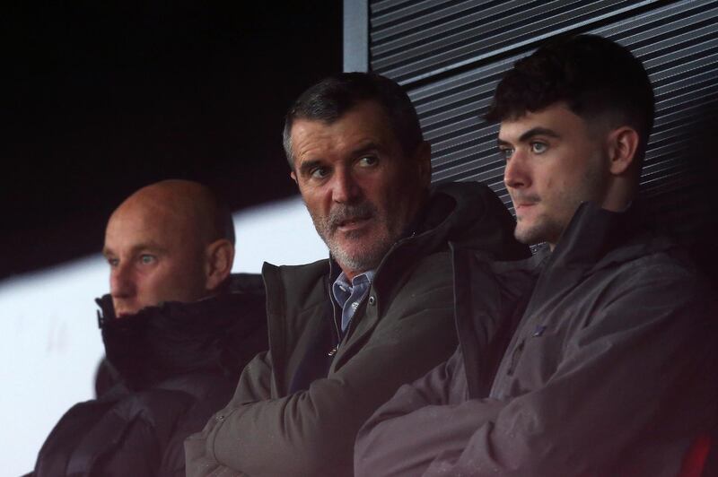 Former Manchester United player Roy Keane, centre, alongside former teammate Nicky Butt, left, at the Crawley game. Getty