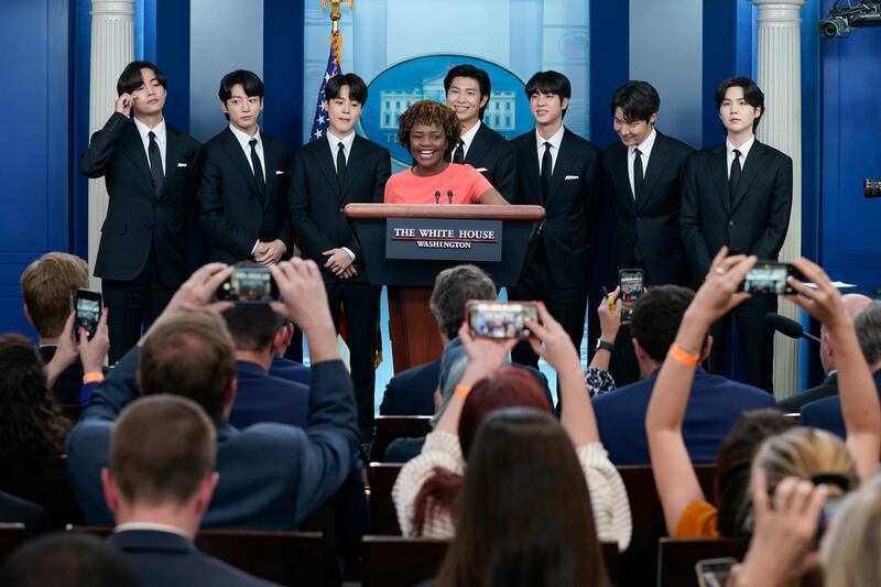 Members of the K-pop supergroup BTS join White House Press Secretary Karine Jean-Pierre during the daily briefing at the White House. AP
