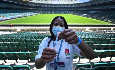 epa09238948 Covid vaccination staff with a Pfizer jab at Twickenham rugby stadium in London, Britain, 31 May 2021. The UK government is pushing ahead with its vaccination program in its fight against the Indian variant. Twickenham rugby stadium has become a mass vaccination centre offering first jabs to everyone over thirty years of age. The UK government plans to lift lockdown restrictions completely 21 June.  EPA/ANDY RAIN