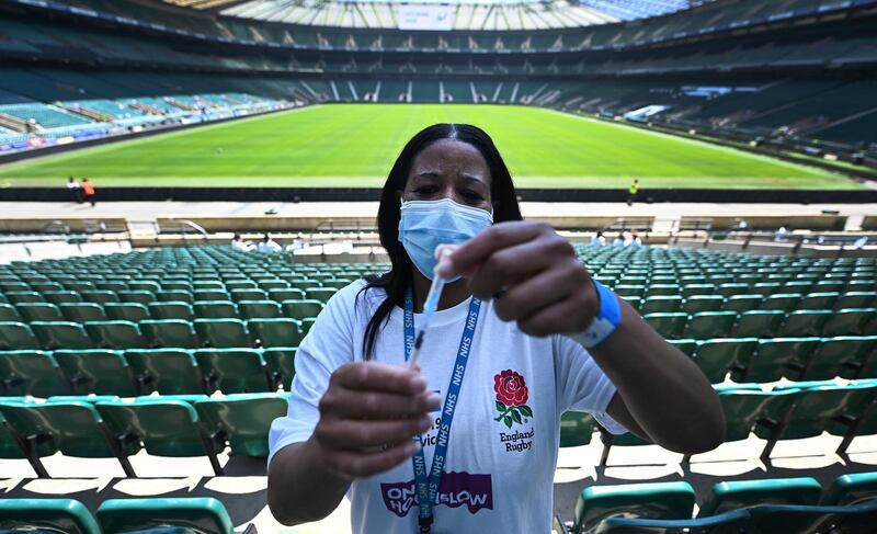 epa09238948 Covid vaccination staff with a Pfizer jab at Twickenham rugby stadium in London, Britain, 31 May 2021. The UK government is pushing ahead with its vaccination program in its fight against the Indian variant. Twickenham rugby stadium has become a mass vaccination centre offering first jabs to everyone over thirty years of age. The UK government plans to lift lockdown restrictions completely 21 June.  EPA/ANDY RAIN