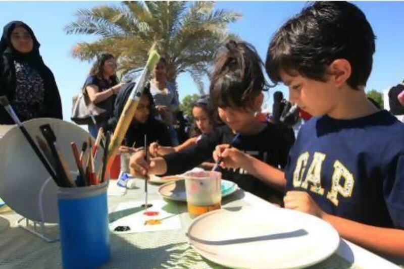 Children painting at a fundraising event organised by "Operation Smile" to help fund their 8 missions to 6 different countries around the world that gives children life changing surgery at no cost yesterday at Abu Dhabi city Golf Club. Ravindranath K / The National