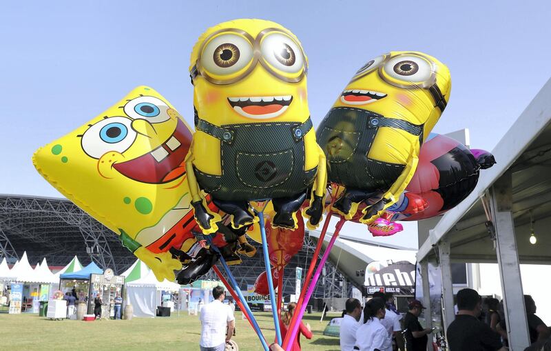 ABU DHABI , UNITED ARAB EMIRATES ,  November 9 , 2018 :- Balloons seller during the Taste of Abu Dhabi held at Du Arena on Yas Island in Abu Dhabi.  ( Pawan Singh / The National )  For News/Online/Instagram