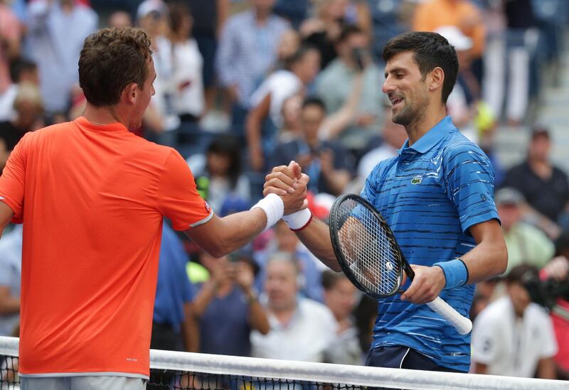 Novak Djokovic shakes hands with Roberto Carballes Baena after winning their match 6-4, 6-1, 6-4. AFP