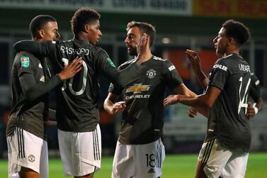 Manchester United's Marcus Rashford (2L) celebrates with teammates after scoring against Luton in the League Cup. EPA