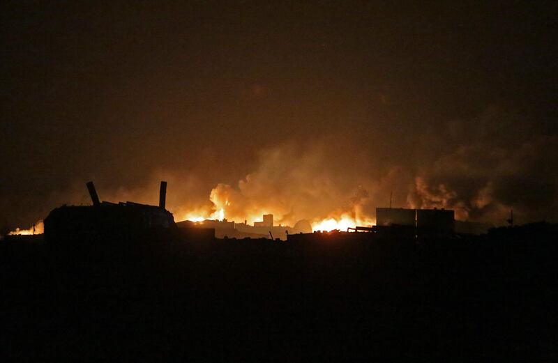 A fire rages after bombardment of makeshift oil refining installations in the Tarhin area, near the Turkish-controlled city of Al Bab in the north of Syria's Aleppo province. AFP