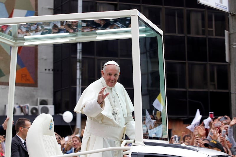 Pope Francis waves to the crowd from the popemobile after visiting an orphanage in Medellin, Colombia in his way to La Macarena stadium, September 9, 2017. REUTERS/Fredy Builes