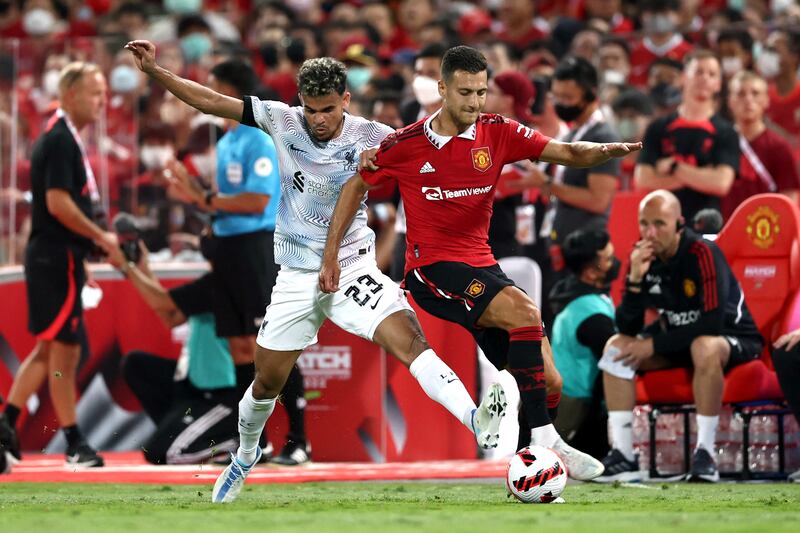 Manchester United's Diogo Dalot in action with Liverpool's Luis Diaz. Reuters