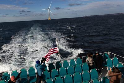 Guests observe the five turbines of America's first offshore wind farm, on December 7, 2023, off the coast of Block Island, Rhode Island. AP Photo