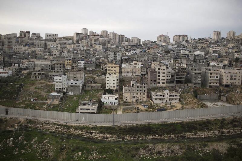 A view of the Shuafat Palestinian refugee camp of surrounded by the Israeli barrier (Separation wall). Palestinian officials have submitted a draft resolution to the UN Security Council that would set a two-year deadline to end Israeli occupation.  EPA/ABIR SULTAN Abir Sultan / EPA