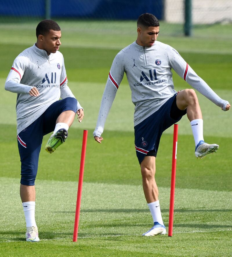 Kylian Mbappe and Achraf Hakimi take part in training. AFP