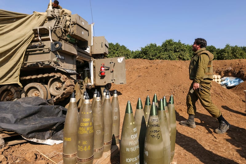 Israeli troops take position near Israel's border with Lebanon, on Wednesday amid increasing tensions as fighting continues with Hamas militants in the southern Gaza Strip. AFP