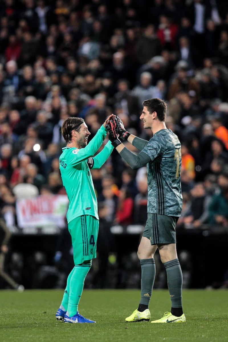 Real Madrid goalkeeper Thibaut Courtois celebrates with Sergio Ramos. EPA