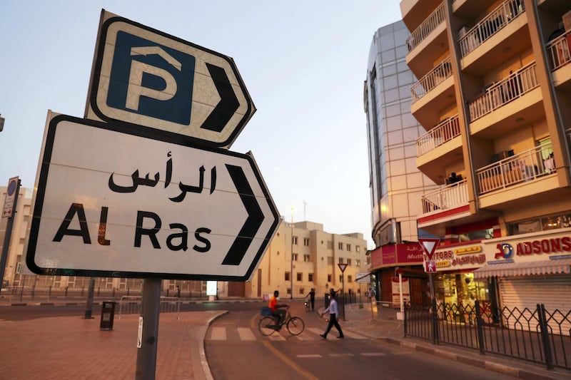 DUBAI, UNITED ARAB EMIRATES , April 27 – 2020 :- People walking on the streets in Al Ras area in Deira Dubai. Authorities ease the restriction for the residents after almost a month long locked down of Al Ras district. (Pawan Singh / The National) For News/Standalone/Online/Instagram