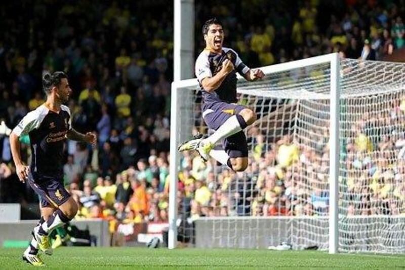 Luis Suarez celebrates after scoring the opening goal of his hat-trick.