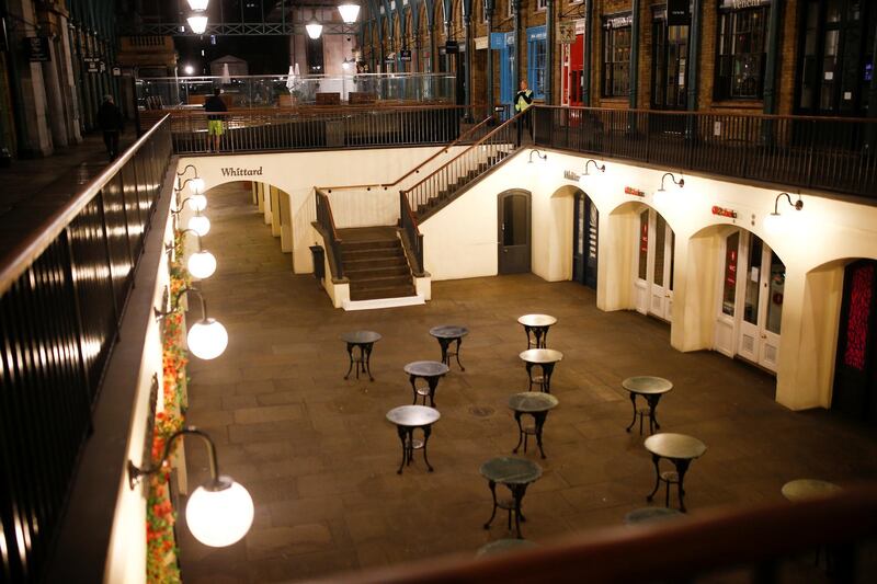 Empty tables are seen in Covent Garden on the day Prime Minister Boris Johnson ordered all venues to close in response to the growing number of coronavirus cases in London, UK, on March 20, 2020. Reuters