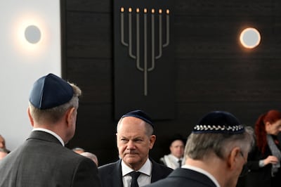 Chancellor Olaf Scholz speaks to John Crosby, US Consul General for Saxony, Saxony-Anhalt and Thuringia, during the opening of the newly built synagogue in Dessau Rosslau, Germany. Reuters
