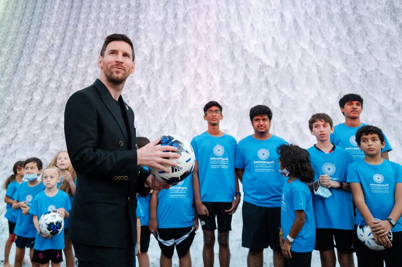 Footballer Lionel Messi poses with schoolchildren in front of the Surreal water feature at Expo 2020 Dubai. All photos: Expo 2020 Dubai