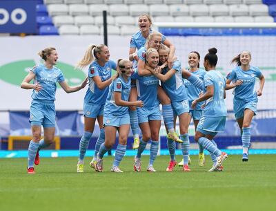 Manchester City's Steph Houghton, centre, celebrates with teammates after scoring in an FA Women's Super League match at Goodison Park, Liverpool. PA