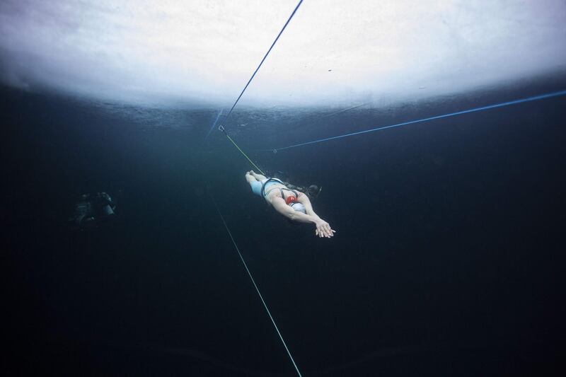 Finland's freediver Johanna Nordblad trains on Tuesday March 16, 2021, two days before establishing the first Official CMAS World Record of freediving under Ice with no diving suit (just a bathing suit), to perform 103 m under ice 60 cm thick, in 2'42 mn without briething.  The water temperature was +3°C and the air -7°C AFP