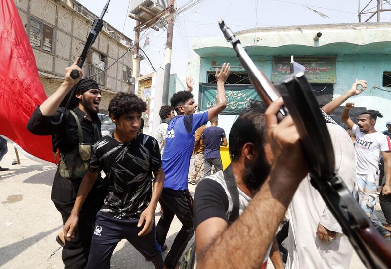 Iraqi protesters demonstrate against their government and the lack of basic services, in Basra.  AFP