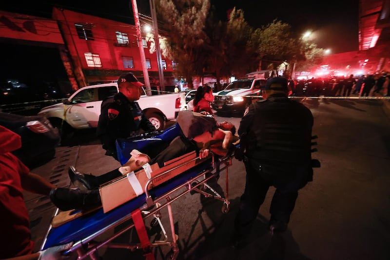 Injured people are carried away by stretcher after a raised subway track collapsed in Mexico City. The Line 12 accident happened between Olivos and Tezonco metro stations. Getty