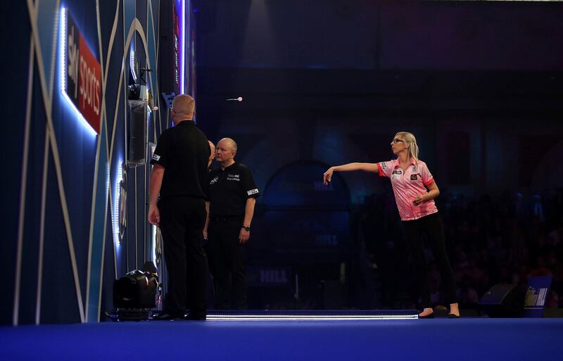 Fallon Sherrock on her way to victory over Mensur Suljovic in the second round of the PDC World Championship at Alexandra Palace, London, on Saturday December 21. In the first round, Sherrock became the first woman to win a match at the event. AP
