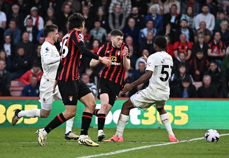Manchester United's Willy Kambwala fouls AFC Bournemouth's Ryan Christie to concede a penalty that was later ruled a free kick by VAR. Reuters