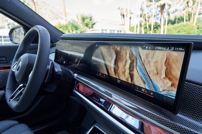 An LED-lit 'Interaction Bar' cleverly conceals air vents and air-con/heating controls. Photo: BMW