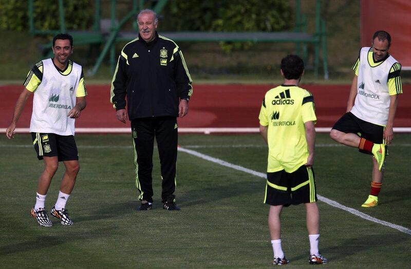 Spain manager Vicente del Bosque, second left, looks on during a team training session on Monday with Xavi, left, Andres Iniesta, right, and Juan Mata, second right, as they prepare for the 2014 World Cup. Sergio Perez / Reuters / May 26, 2014