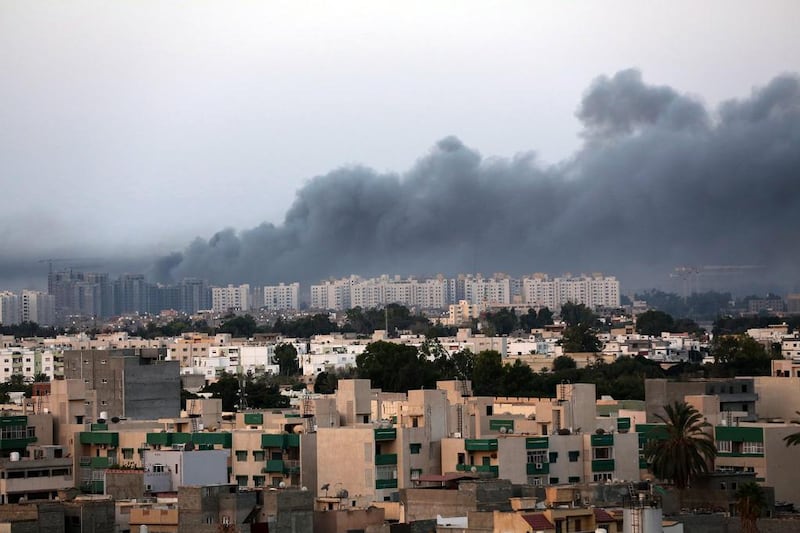 Smoke fills the sky over Tripoli after fighting between militias of 'Libya Fajr' (Dawn of Libya) and 'Karama' (Dignity) in Tripoli, Libya (EPA/STR)