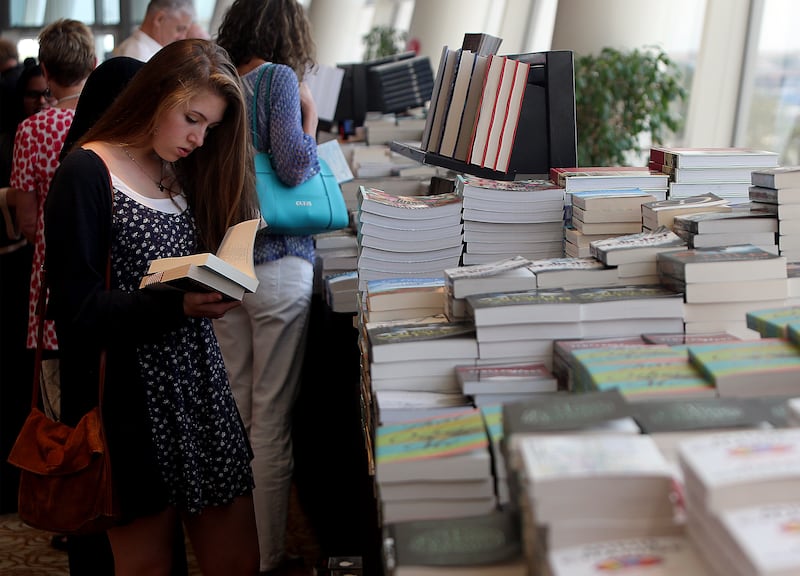 Dubai, United Arab Emirates-March, 11, 2016:  Kids reading books at the  Emirates Airline Festival of Literature  in Dubai.  ( Satish Kumar / The National  ) 
Section: News *** Local Caption ***  SK-Literature-11032016-02.jpg